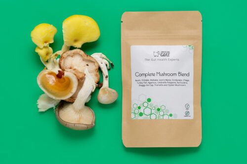 Package of Chuckling Goat Complete Mushroom Blend next to assorted mushrooms.